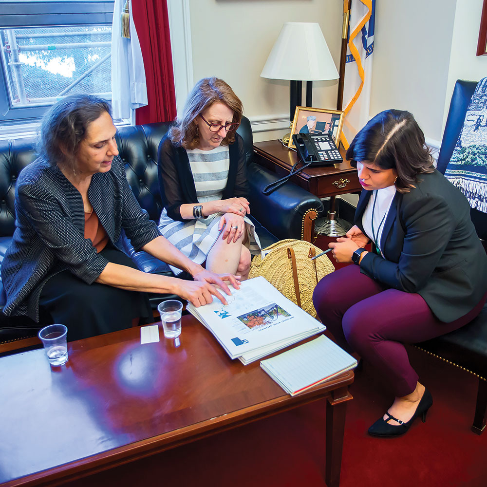 Carole Schlessinger and Deneen Crosby discuss a Massachusetts Great Place with U.S. Rep. Stephen Lynch’s (D-Mass.) staff. American Planning Association photo.