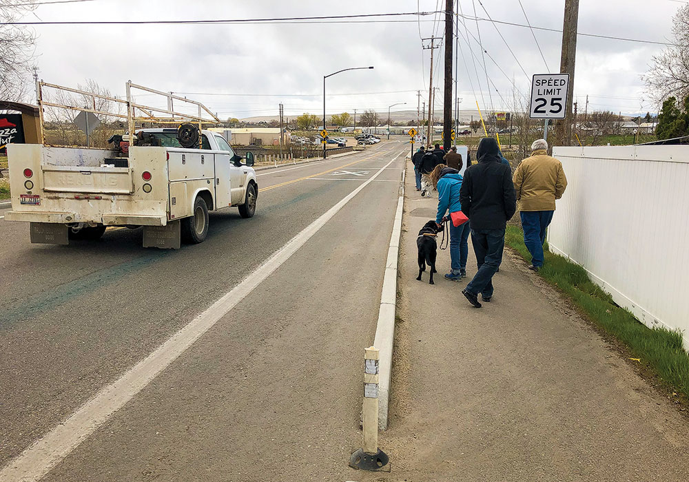 Extruded curb treatments, like these in Kuna, Idaho, are used in Emmett and other rural areas to create safe pedestrian walkways without the full cost of sidewalks. Photo by Don Kostelec.