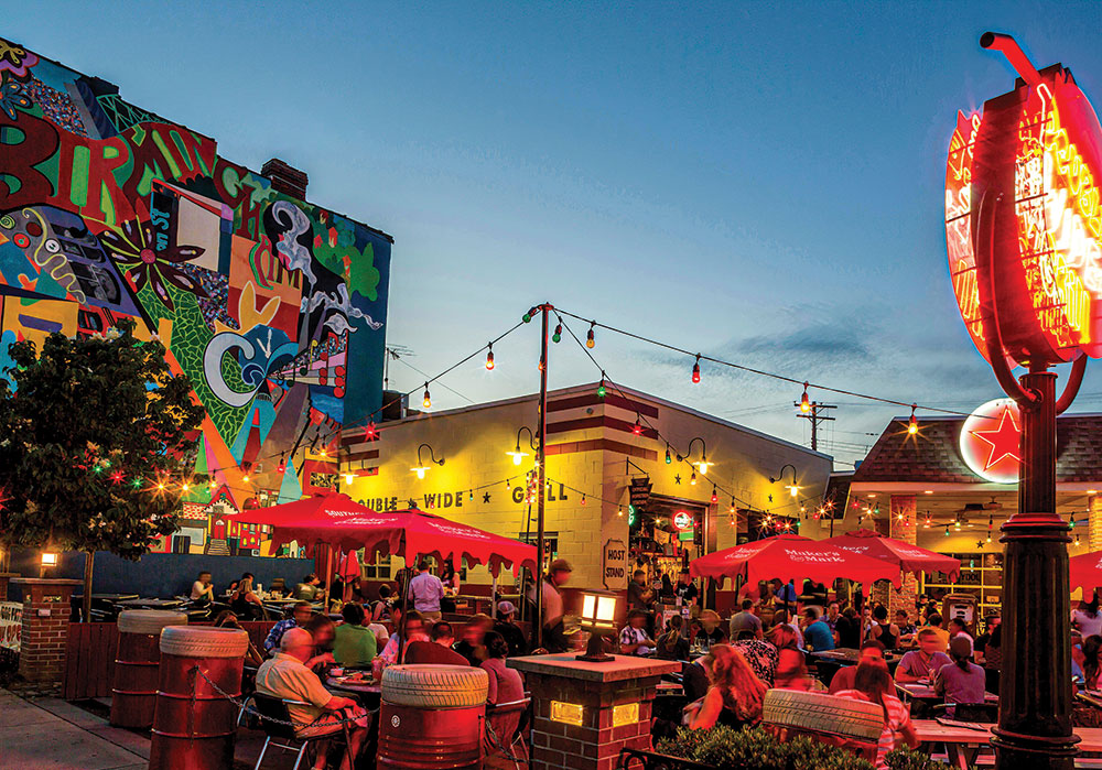 The main drag of Pittsburgh’s South Side — East Carson Street — is home to some 40 bars, including the historic Double Wide Grill. Allison Harnden, Pittsburgh’s nighttime economy manager, helped rally city officials and government departments behind a strategy to raise funds for safety and sanitation enhancements. Photo by Russell Kord/Alamy.