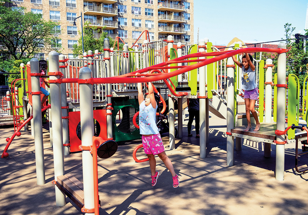 Bowne Park in downtown Flushing, Queens, as it looks now. The playground reopened in August 2019 and has new play equipment, swings, basketball and handball courts, and new landscaping, as well as green infrastructure improvements. Photo courtesy NYC Parks.