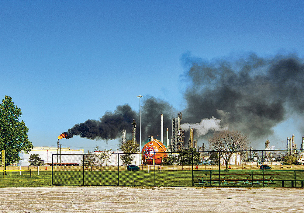 The Marathon Petroleum refinery operates across the freeway from sports playing fields.