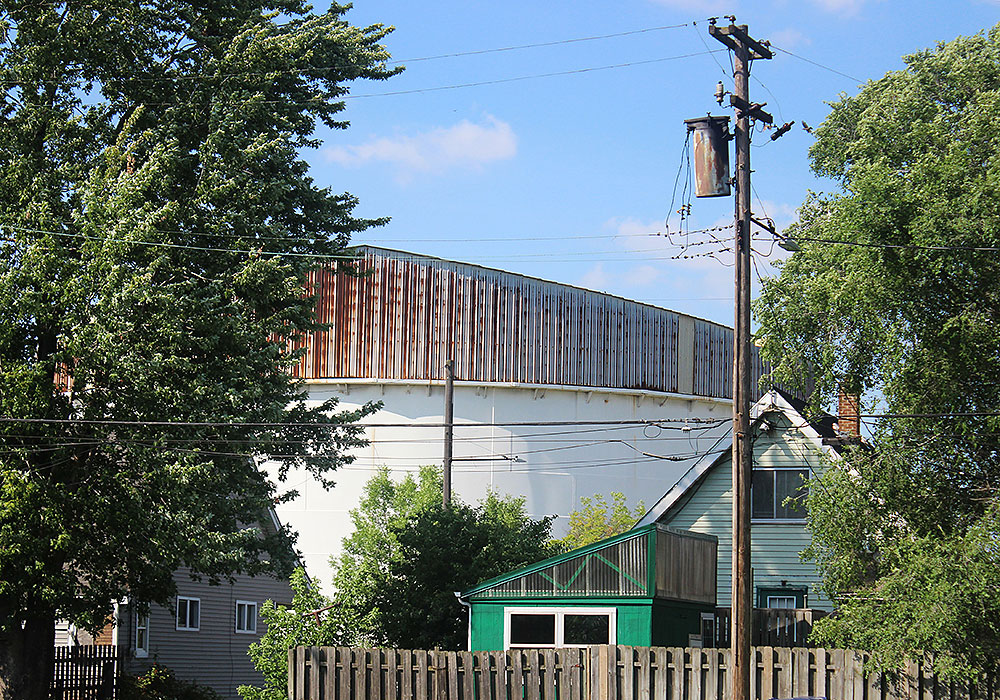 Residential and industrial land uses are close neighbors. Here, River Rouge homes sit directly across the street from an oil tank farm.