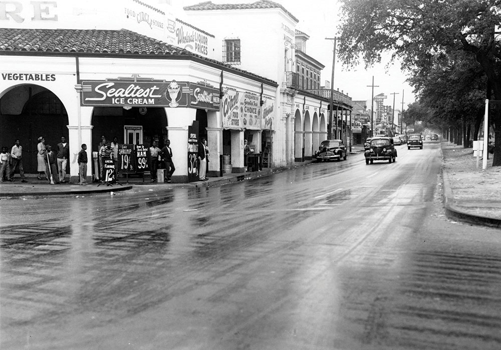 Before the expressway cut through Claiborne Avenue, above, it was lined with old-growth oaks and booming Black-owned businesses. Photo from the Charles L. Franck Studio Collection at the Historic New Orleans Collection, Acc. No. 1979.325.5138.