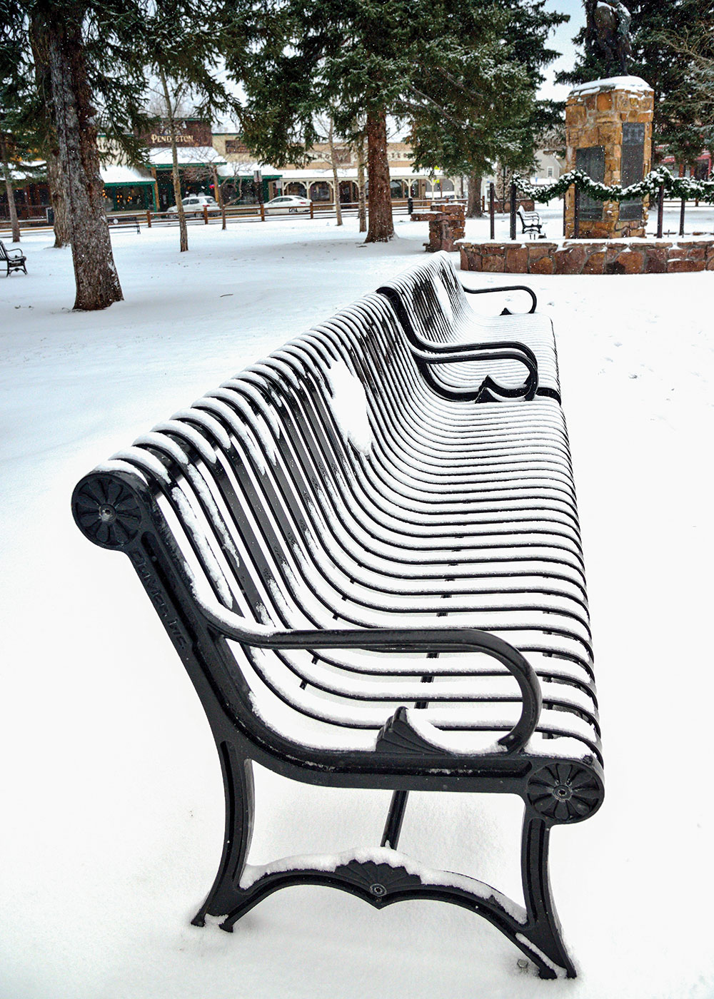 Officials scrapped plans for Western-themed benches made of elk antlers in favor of benches designed to accommodate seniors — with rounded armrests, slightly angled backrests, and no sharp edges — in downtown Jackson Hole, Wyoming's Town Square. Photo by Ivan Sebborn/Alamy Stock Photo.