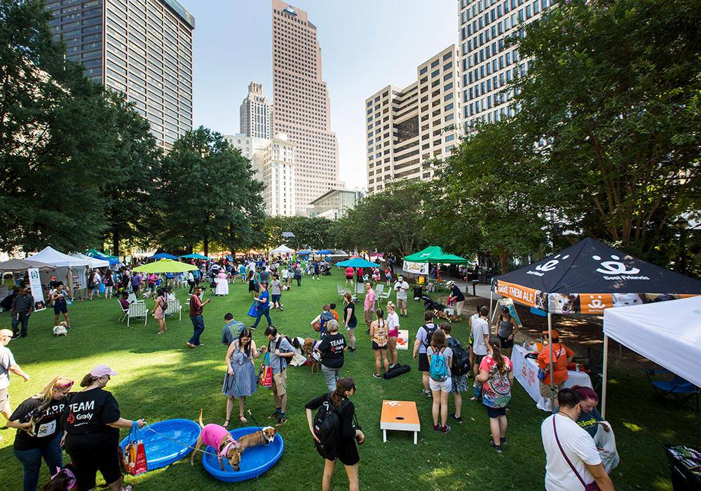 Playful events like the Doggy Con Pet Parade and Costume Contest in Atlanta’s Woodruff Park allow people from all walks of life to come together. Photo by Raftermen.