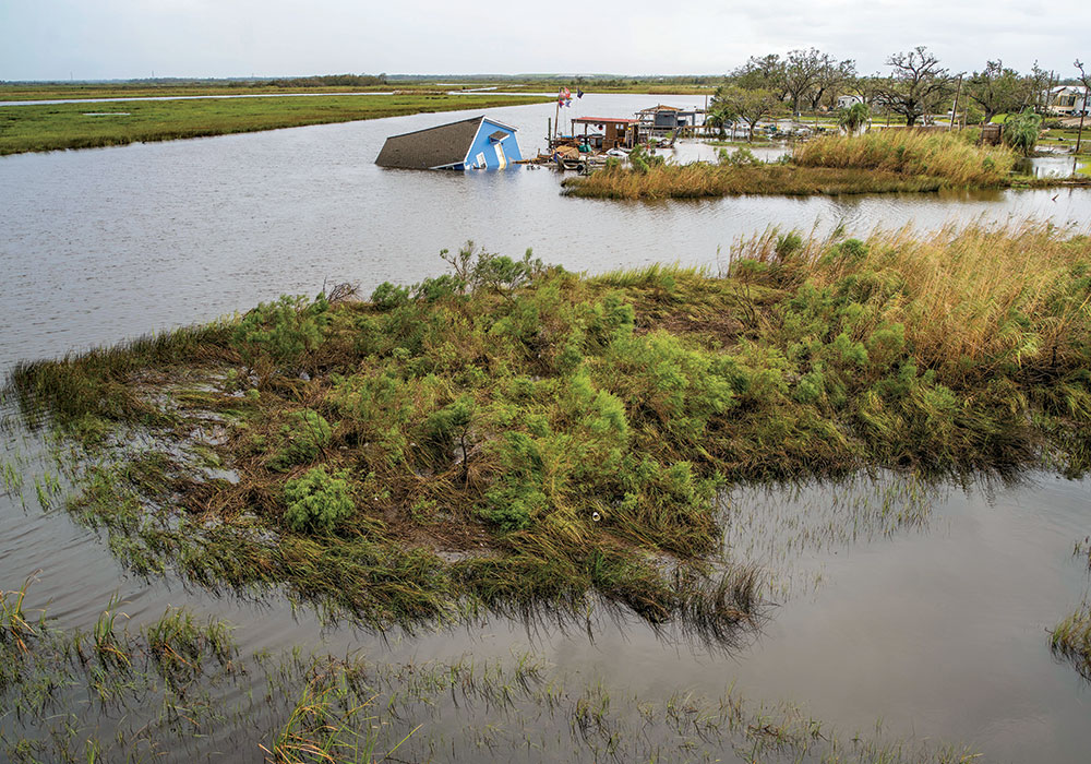 Planning Winter 2021 Climate Migrants Are on the Move A building submerged in flooding after Hurricane Laura swept through Carlyss, Louisiana, in August 2020. Photo by Matthew Busch/The New York Times.