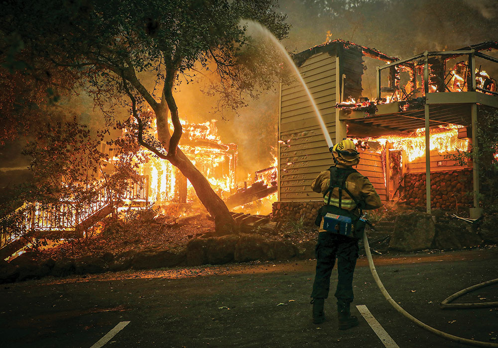Planning Winter 2021 Climate Migrants Are on the Move Firefighters work to put out a fire engulfing a hotel structure in St. Helena, California, in September 2020. Photo by Jim Wilson/The New York Times.