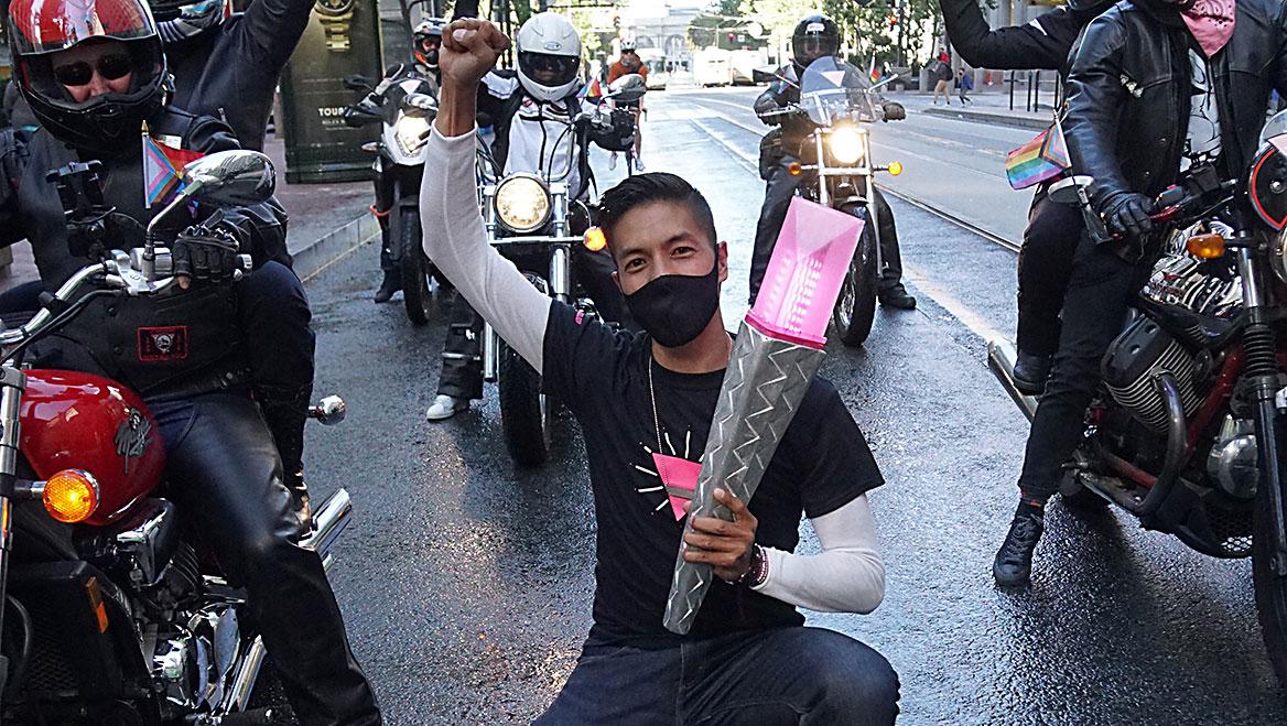 Robin Abad was the torchbearer for the Pink Torch Procession 2021, a ceremonial procession from Oakland to Twin Peaks in San Francisco marking the start of Pride month in the Bay Area. Photo by Ben Davis.