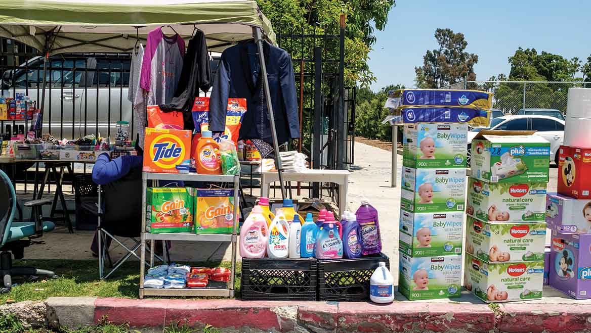 A vendor sets up shop at a curb in Los Angeles, which hosts a vibrant informal economy largely driven by Latina/o and immigrant small-scale entrepreneurs. Photo by Rudy Espinoza.