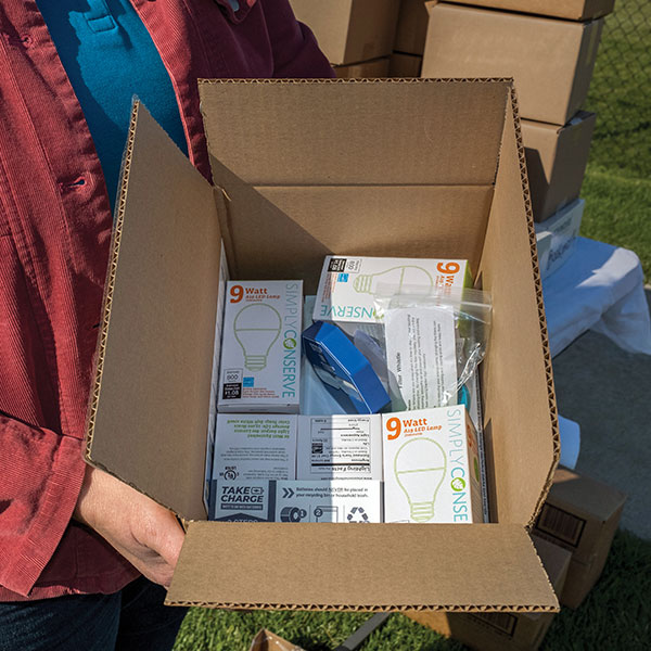 Distribution of the conservation kits created an opportunity for conversations among neighbors about climate change. Photo by Nick Rohlman.