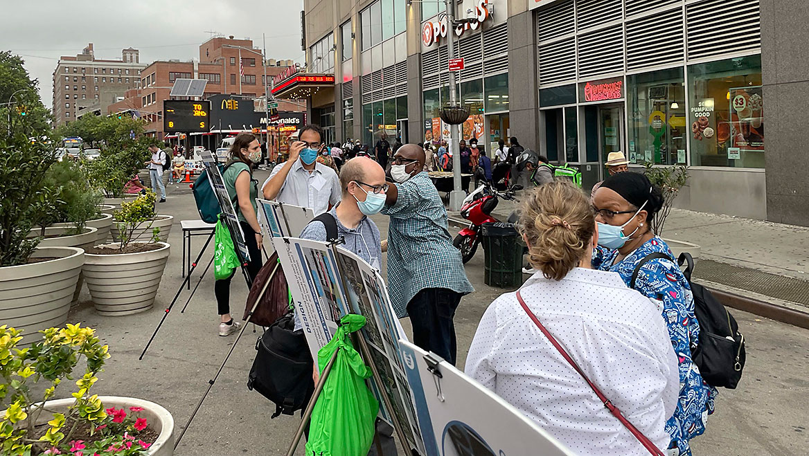 During an outdoor open house in downtown Jamaica, Queens, planners were able to reach a broader audience on a plan for busways in the area. Photo courtesy NYC DOT.