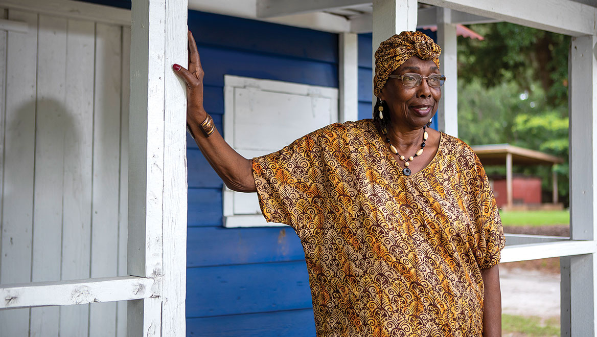 Louise Cohen, director of the Gullah Museum of Hilton Head Island, on the porch of the William Simmons house, a typical Gullah farm community home built in 1930. The house became the museum in 2011. Photo by Bailey Davidson.