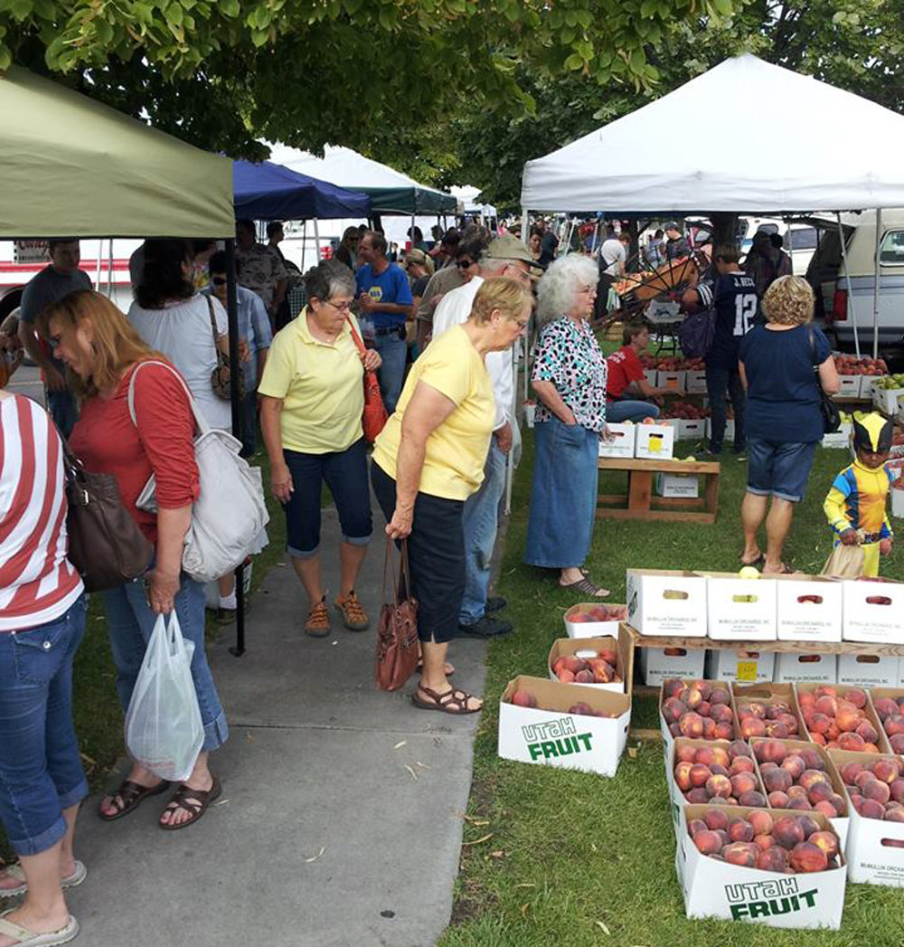 Newly revitalized public spaces downtown help drive events like the successful farmers market on Main Street. Photo courtesy RK Creative Studio.