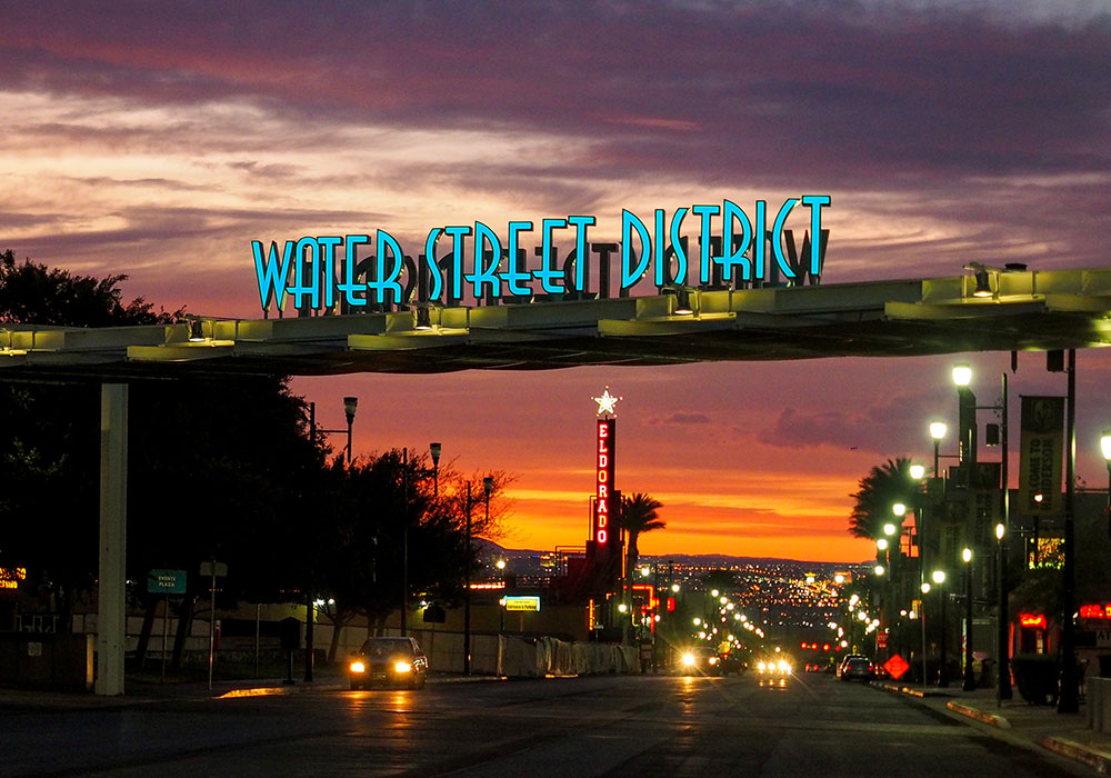 Water Street District welcome sign at sunset. Photo by Mikel Photography.