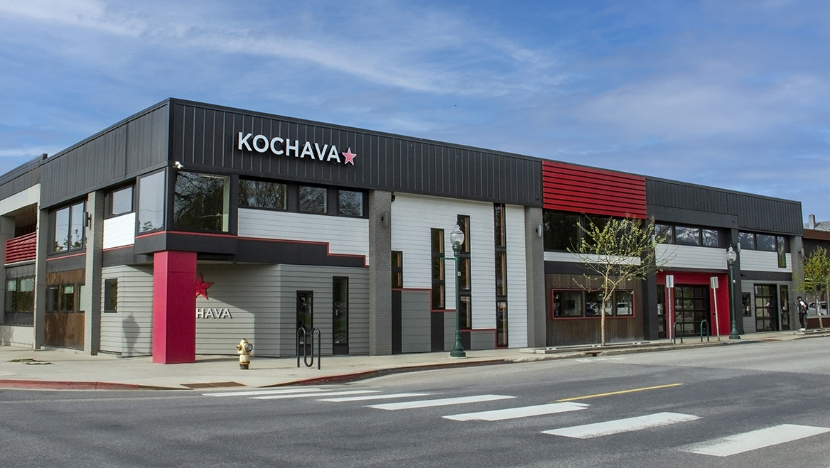 Reduced parking minimums made building renovations and redevelopments more affordable for small business startups. Tech company Kochava renovated an old lumber facility into a modern tech campus, which houses close to 100 full time employees. Photo courtesy of Riley Emmer, Kochava.