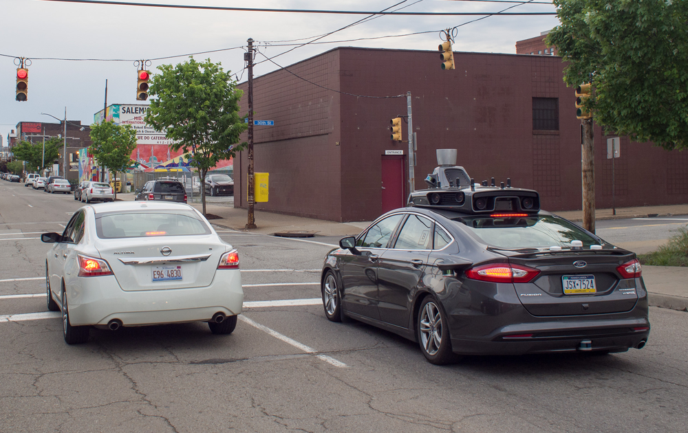 An Uber self-driving car cruises the streets of Pittsburgh in May 2016. Photo by Flickr user Foo Conner (CC BY 2.0).